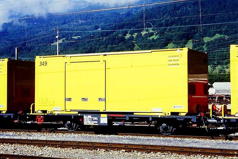 RhB - Lb-v 7865 am 20.06.1999 in Landquart - Container-Tragwagen 2-achsig mit Post-Container - Baujahr 1963 - JMR - Gewicht 5,63t - Ladegewicht 14,00/17,00t -  zulssige Geschwindigkeit 14t/80 17t/60 km/h - LP 9,14m - 3=20.04.1999 2=21.05.2008 - Lebenslauf: ex K 5056 - 1969 Gb 5056 - 11/1998 ausr. - 20.04.1999 Lb-v 7865 - 17.07.2006 Lb 7865

