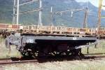 RhB - Lck 7822 am 29.08.1995 in Castione-Arbedo - Schutzwagen (ehemals Langholztransportwagen) 2-achsig - Baujahr 1907 - Ringh - Fahrzeuggewicht 3,11t - Zuladung 10,00t - LP 3,70m -zulssige