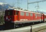 Lokomotiven/309471/rhb---ge-66-ii-701 RhB - Ge 6/6 II 701 'RAETIA' am 20.02.1998 in Thusis - Universallokomotive - bernahme 09.05.1958 - SLM4220/MFO/BBC - 1776 KW - Gewicht 65,00t - LP 14,50m - zulssige Geschwindigkeit 80 km/h - Logo RhB rhtoromanisch - 2=16.12.1993 1=17.07.1997- Hinweis: runde Scheinwerfer und Scherenpantograf, gescanntes Dia 
