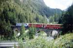 RhB - Regio-Express 1144 von St.Moritz nach Chur am 21.08.2008 auf Albula-Viadukt I mit E-Lok Ge 4/4 III 650 - B 2451 - B 2457 - A 1236 - A 1238 - B 2391 - B 2437 - B 2359 - D 4214 - Sbkv 7715  