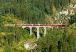 RhB - Bernina-Express 951 von Chur nach Tirano am 15.07.2013 auf Schmittentobel-Viadukt mit Zweisystem-Triebwagen ABe 8/12 3502 (ABe 4/4 35.002 - Bi 35.602 - ABe 4/4 35.102) - Ap 1292 - Api 1304 - Bps