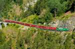 RhB - Regio-Express 1125 von Chur nach St.Moritz am 15.07.2013 zwischen Schmittentobel-Viadukt und Zalaint-Tunnel mit Ge 4/4 III 647 - D - B - B - B - A - A - B - B  