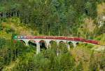 albulabahn-chur-stmoritz/312599/rhb---regio-express-1128-von-stmoritz RhB - Regio-Express 1128 von St.Moritz nach Chur am 15.07.2013 auf Schmittentobel-Viadukt mit E-Lok Ge 4/4 III 652 - B - B - A - A -A - B - B - B - D
