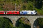 albulabahn-chur-stmoritz/312648/rhb-regio-express-1129-von-chur-nach RhB Regio-Express 1129 von Chur nach St.Moritz am 15.07.2013 auf Schmittentobel-Viadukt mit E-Lok Ge 4/4III 649 - D - B - B - B - A - A - B - B - Hinweis: Lok-Werbung: 20 Minuten
