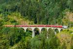 albulabahn-chur-stmoritz/312649/rhb-regio-express-1129-von-chur-nach RhB Regio-Express 1129 von Chur nach St.Moritz am 15.07.2013 auf Schmittentobel-Viadukt mit E-Lok Ge 4/4III 649 - D - B - B - B - A - A - B - B - Hinweis: Lok-Werbung: 20 Minuten
