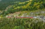 RhB Regio-Express 1129 von Chur nach St.Moritz am 15.07.2013 bei Zalaint-Tunnel mit E-Lok Ge 4/4III 649 - D - B - B - B - A - A - B - B - Hinweis: Lok-Werbung: 20 Minuten  