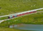 RhB - Bernina-Express 976 von Tirano nach St.Moritz am 14.07.2013 am Lago Pitschen mit Triebwagen ABe 4/4 III 55 - ABe 4/4 III 56 - Bp 2523 - Bp 2521 - Bps 2515 - Api 1306 - Ap 1291  