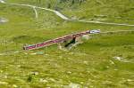 RhB - Bernina-Express 973 von St.Moritz nach Tirano am 14.07.2013 auf Oberer Berninabach-Brcke mit Triebwagen ABe 4/4 III 51 - ABe 4/4 III 52 - Ap 1292 - Api 1304 - Bps 2512 - Bp 2525 -Bp 2502 - Bp