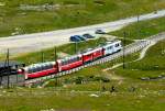 RhB - Bernina-Express 973 von St.Moritz nach Tirano am 14.07.2013 Ausfahrt Galerie Arlas mit Triebwagen ABe 4/4 III 51 - ABe 4/4 III 52 - Ap 1292 - Api 1304 - Bps 2512 - Bp 2525 -Bp 2502 - Bp 2526  