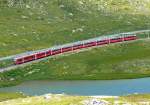 RhB - Bernina-Express 950 von Tirano nach Chur am 14.07.2013 am Lago Pitschen mit Zweisystem-Triebwagen ABe 8/12 3502 (ABe 4/4 35.002 - Bi 35.602 - ABe 4/4 35.102) - Bps 2514 - Bp 2526 - Bp 2502 - Bp