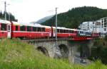 RhB - Bernina-Express 973 von St.Moritz nach Tirano am 25.07.2010 Ausfahrt St.Moritz auf Inn-Viadukt mit ABe 4/4 III 55 - ABe 4/4 III 53 -  Ap - Ap - Bp - Bp - Bp - Bp.