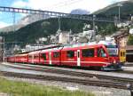 RhB - Regionalzug 1649 von St.Moritz nach Tirano am 15.07.2010 in St.Moritz mit Zweisystem-Triebwagen ABe 8/12 3505 (ABe 4/4 351.05 - Bi 356.05 - ABe 4/4 350.05) - A 531.01 - B 2451 - B 2452 - B 2458